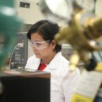 NIST research chemist Connie Remoroza analyzes a sample of African Lion’s milk in a mass spectrometer as part of a research project to characterize the components of milk from humans and other species. Credit: Rich Press/NIST.